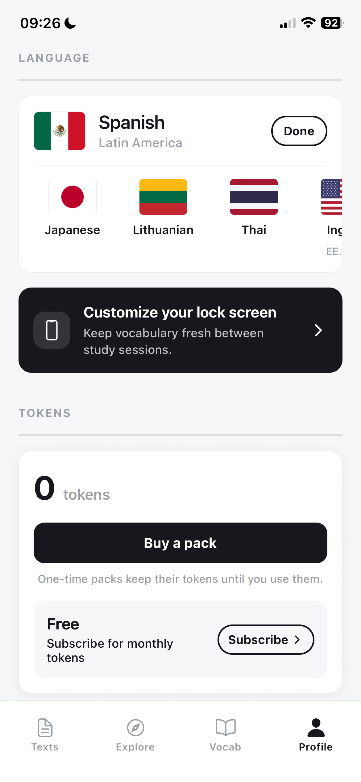 Contexta profile screen with a language picker for Spanish, Japanese, Lithuanian, Thai and English, plus an AI token balance